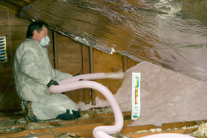 Fiberglass Insulation being used to add energy efficiency to an attic in Windsor